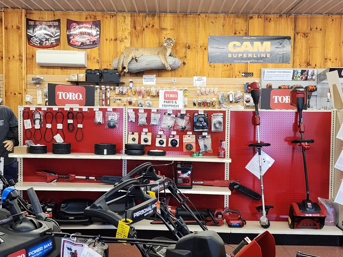 A store display of Toro lawn equipment, parts, and accessories.